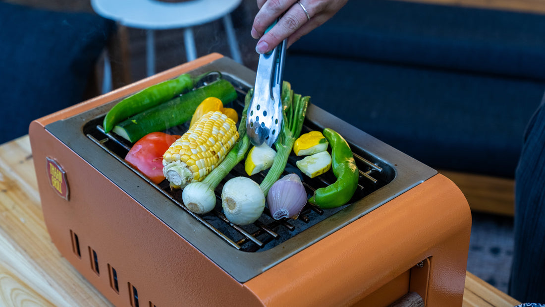 Grilling vegetables on the Thaan Grill over live fire