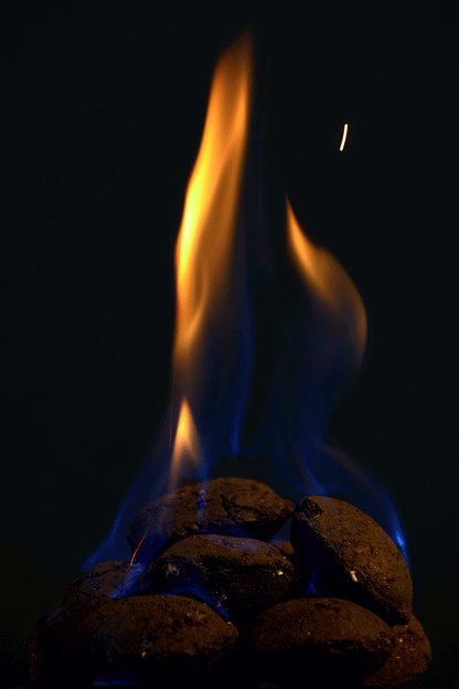 High Desert Blend briquettes catching flame